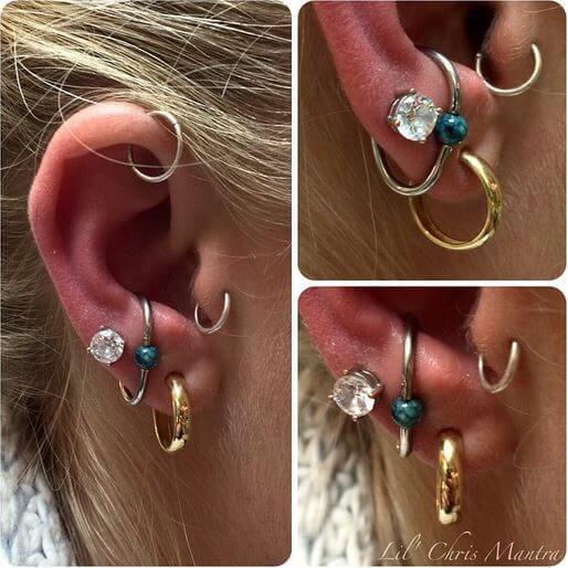 Lower conch with a teardrop captive ring by Lil Chris