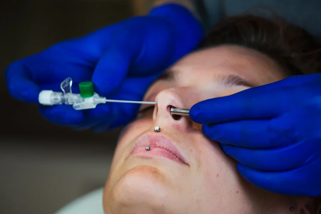 photo - a client receiving a piercing