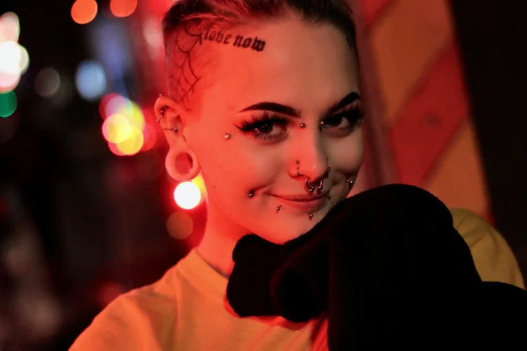 photo - a woman is happy to learn what is a dermal piercing