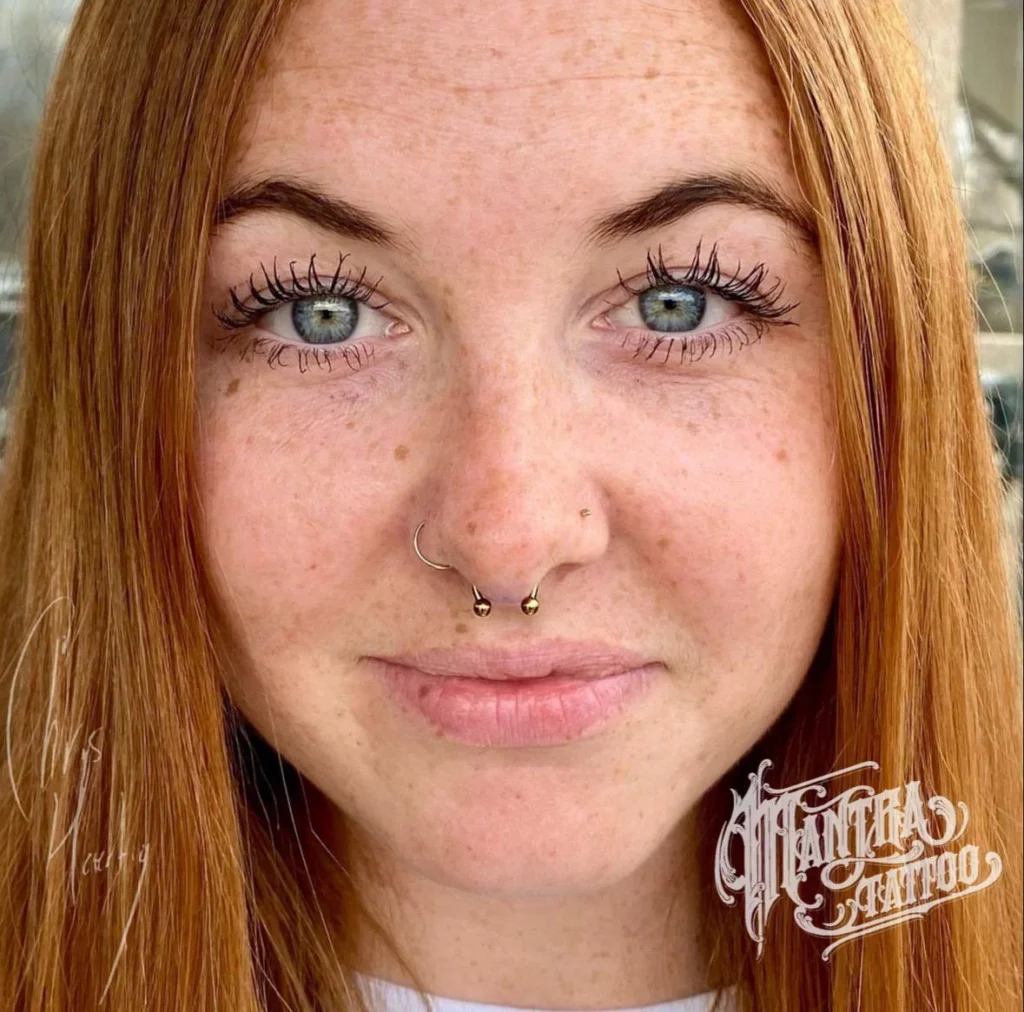 photo - a woman with the best jewelry for piercings in denver looking at the camera