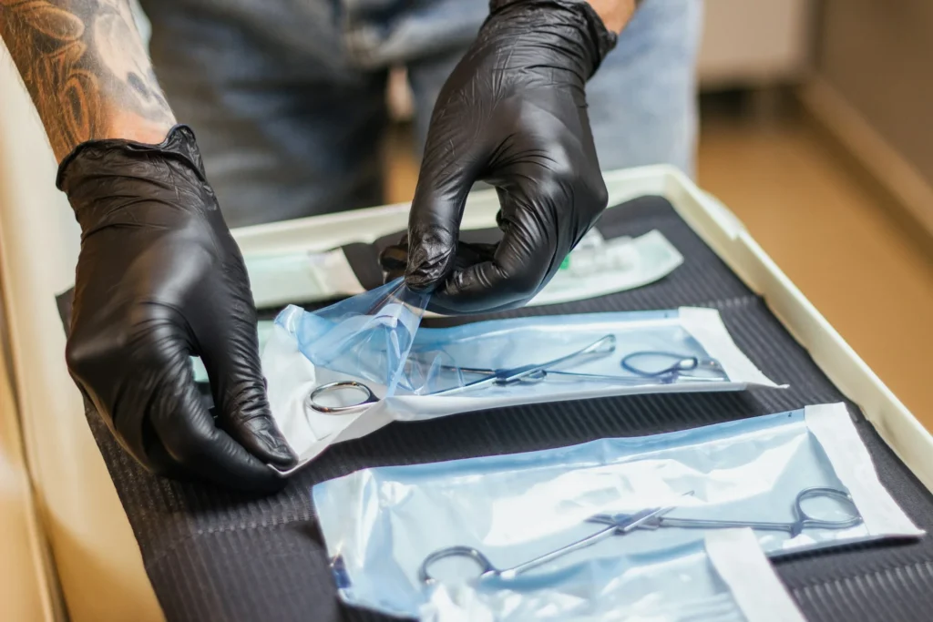 photo - a piercer in denver preparing to do a nose piercing