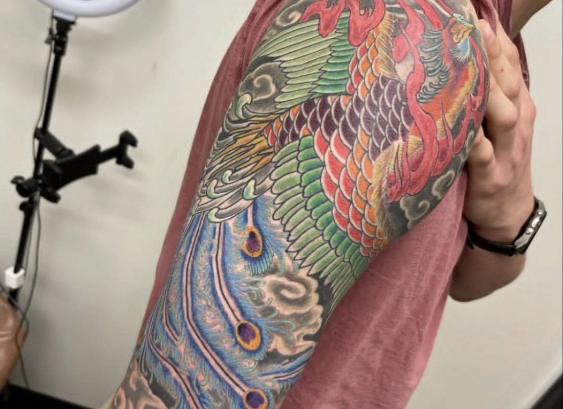 Close-up of a vibrant, colorful portrait tattoo